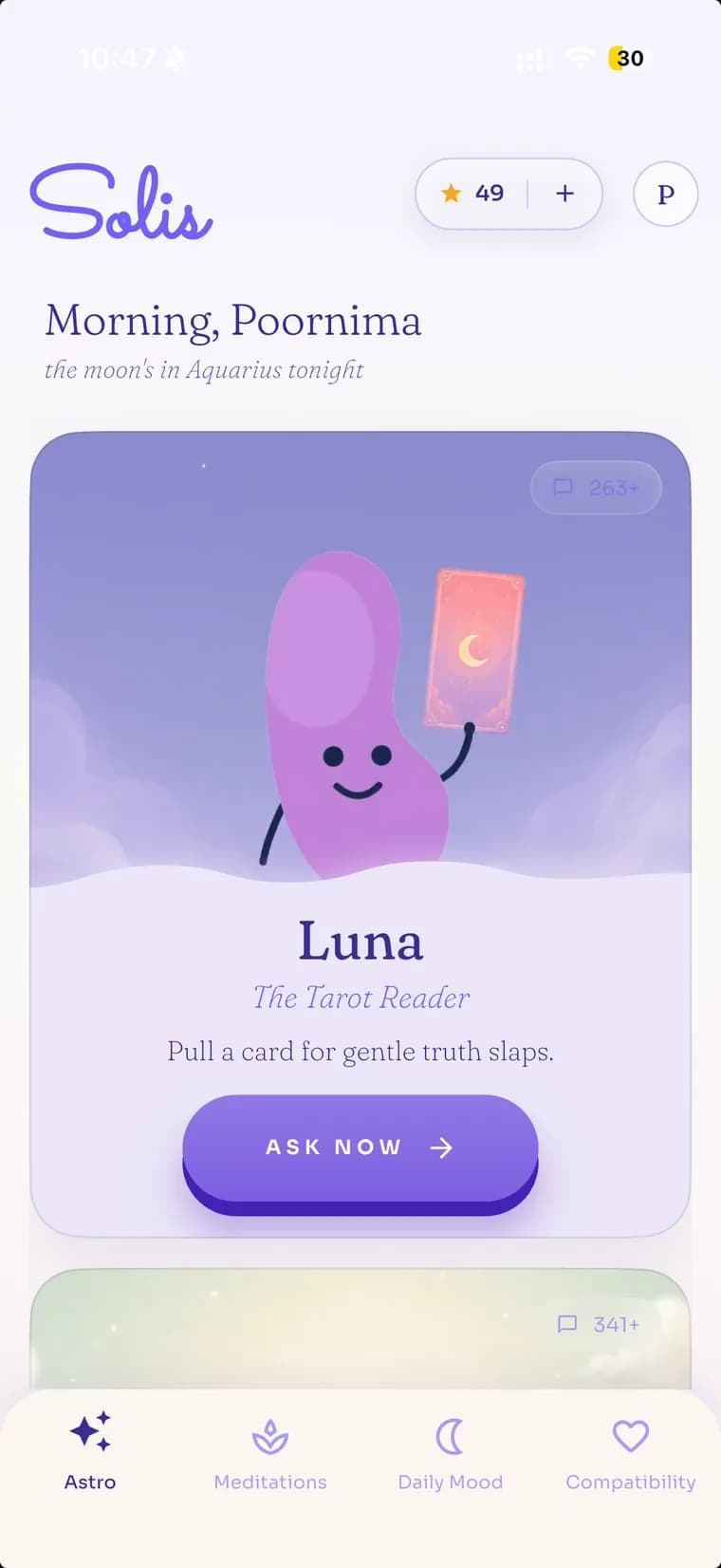 Luna, the tarot reader, holding up a card